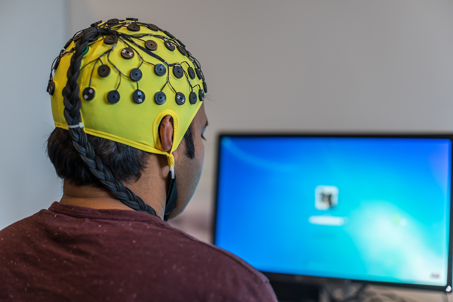 During an Electroencephalography (EEG) electrodes measure and record electrical signals or voltage fluctuations of nerve cells underneath the skin.